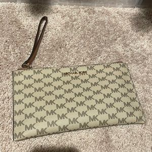 Like new Michaela Kors wristlet. Large.
